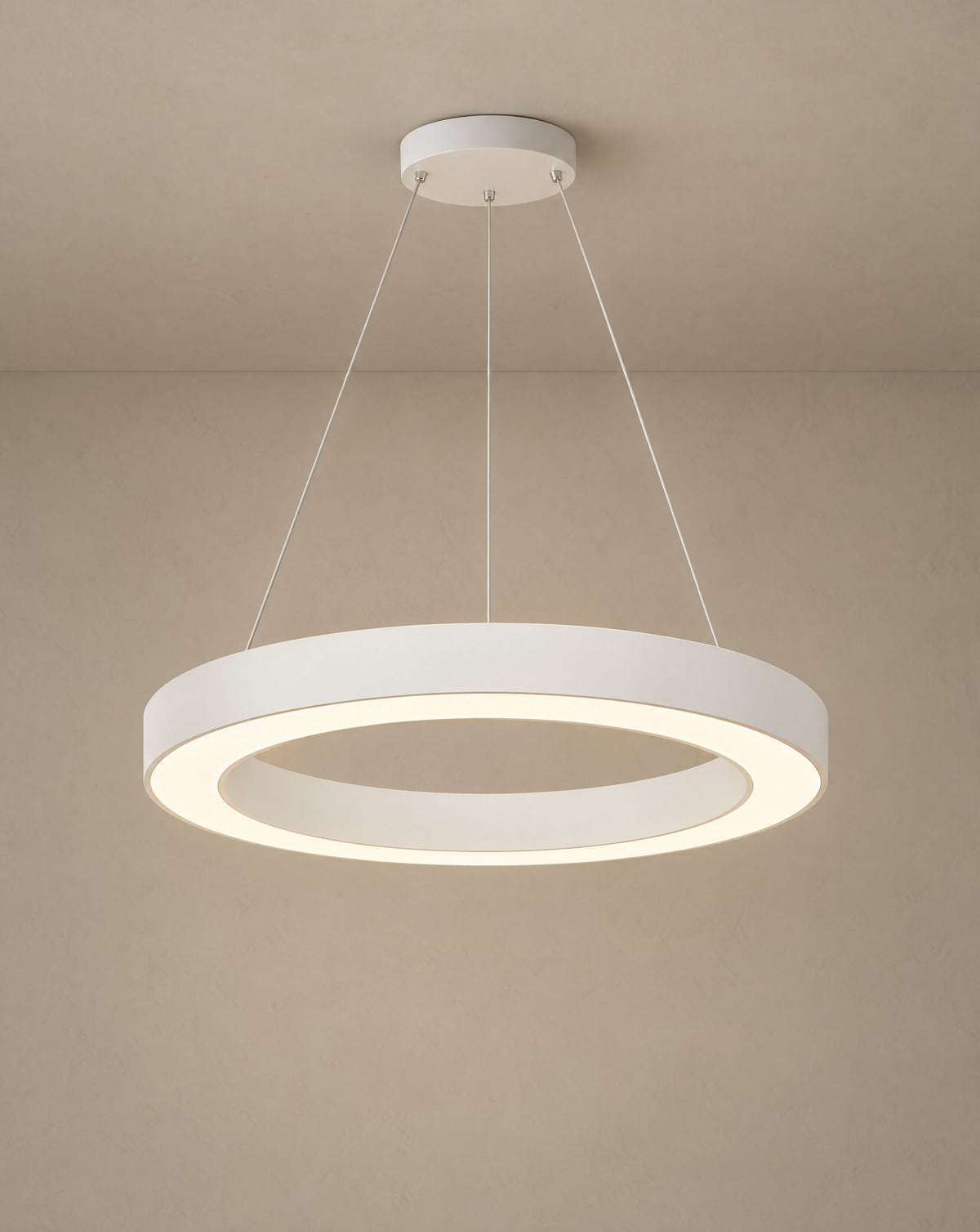 Solsence Corona white ring pendant light lit with warm 3000K glow against a greige backdrop