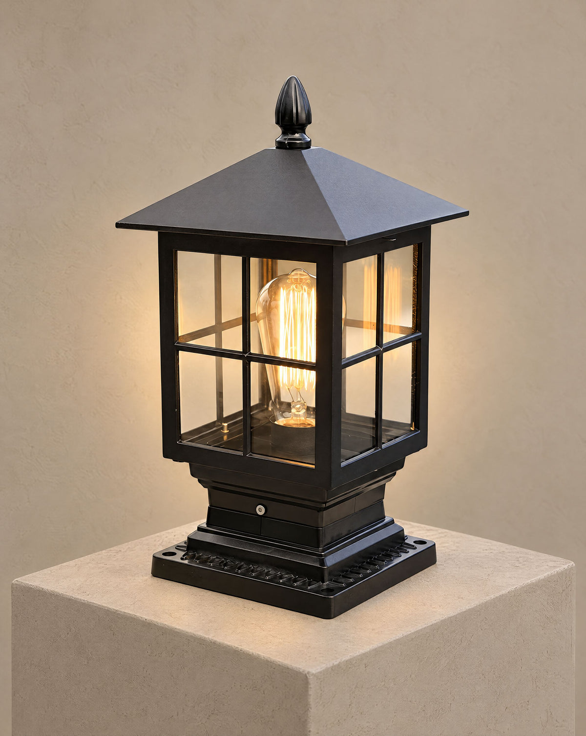 Solsence Aldwin traditional pillar light lit with warm 3000K glow on a greige wall