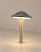 Solsence Morel mushroom path light lit with warm 3000K glow on a greige wall