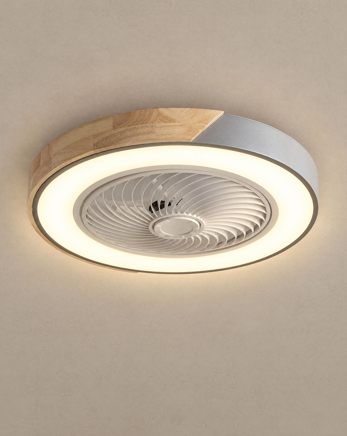 Solsence Aeris gray round bladeless ceiling fan with light lit with warm 3000K glow against a greige backdrop