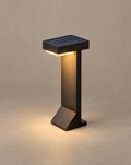Solsence Tessel solar path light lit with warm 3000K glow against a greige backdrop
