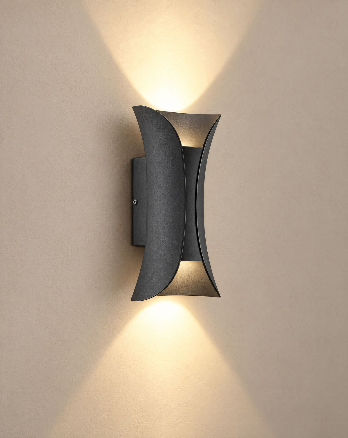 Solsence Vega matte black up-down LED outdoor wall light lit with warm 3000K glow on a greige wall