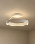 SCI Lighting Solis ring ceiling light - Matte White lit with warm 3000K glow on a greige wall