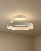 SCI Lighting Solis ring ceiling light - Matte White lit with warm 3000K glow on a greige wall