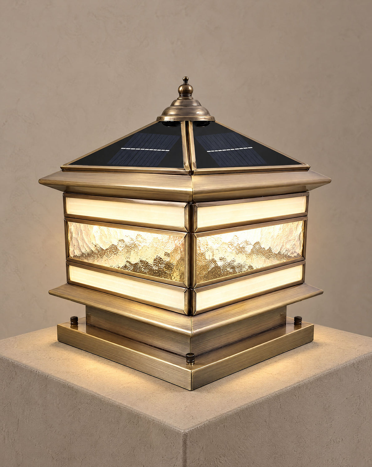 Solsence Halcyon solar copper pillar light lit with warm 3000K glow on a greige wall
