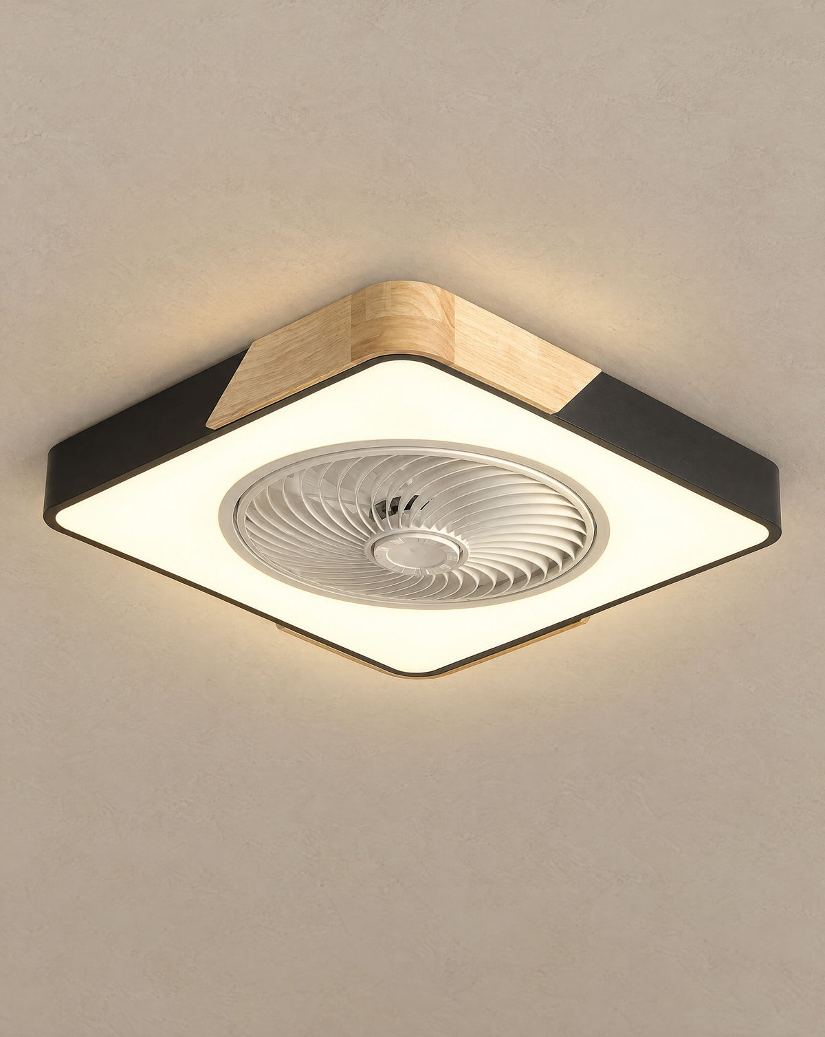 Solsence Aeris black square bladeless ceiling fan with light lit with warm 3000K glow against a greige backdrop