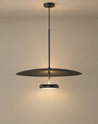 Solsence Walden mid-century pendant light - Black lit with warm 3000K glow on a greige wall
