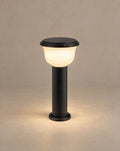 Solsence Calyx hardwired path light lit with warm 3000K glow against a greige backdrop