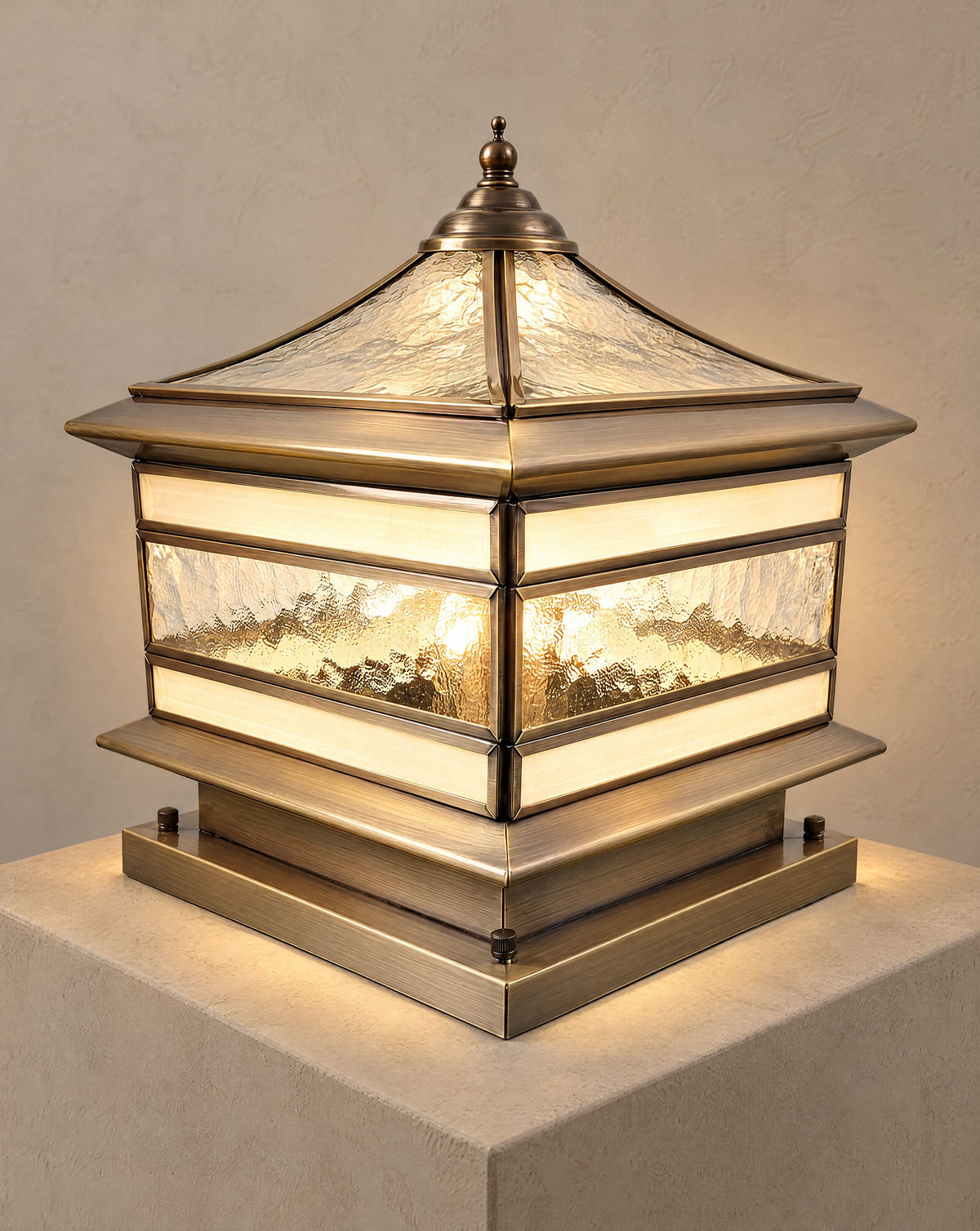 Solsence Halcyon hardwired copper pillar light lit with warm 3000K glow on a greige wall