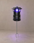 Solsence Nox mosquito trap path light - Stake lit with warm 3000K glow on a greige wall