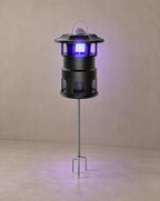 Solsence Nox mosquito trap path light - Stake lit with warm 3000K glow on a greige wall