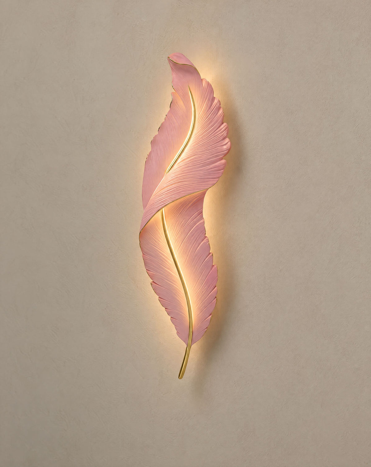 Solsence Plume pink feather wall light lit with warm 3000K glow on a greige wall