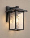 SCI Lighting Corbin outdoor wall lantern lit with warm 3000K glow on a greige wall