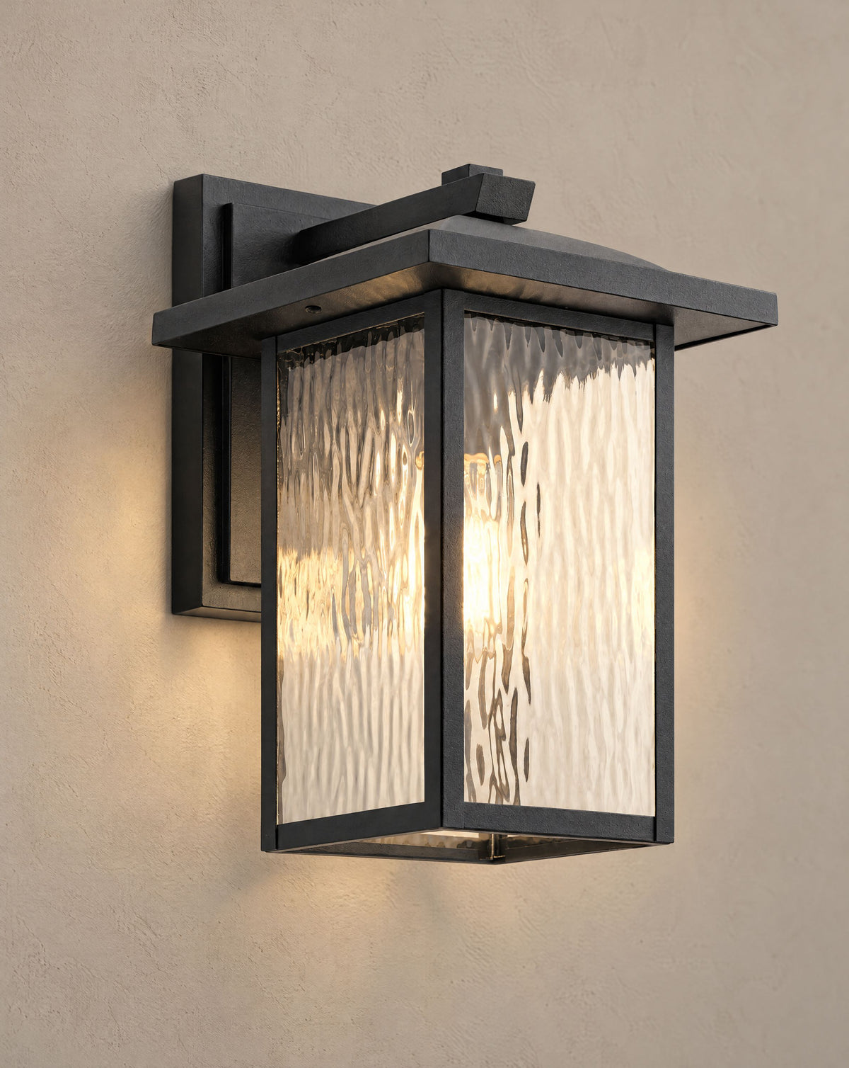 Solsence Corbin outdoor wall lantern lit with warm 3000K glow on a greige wall