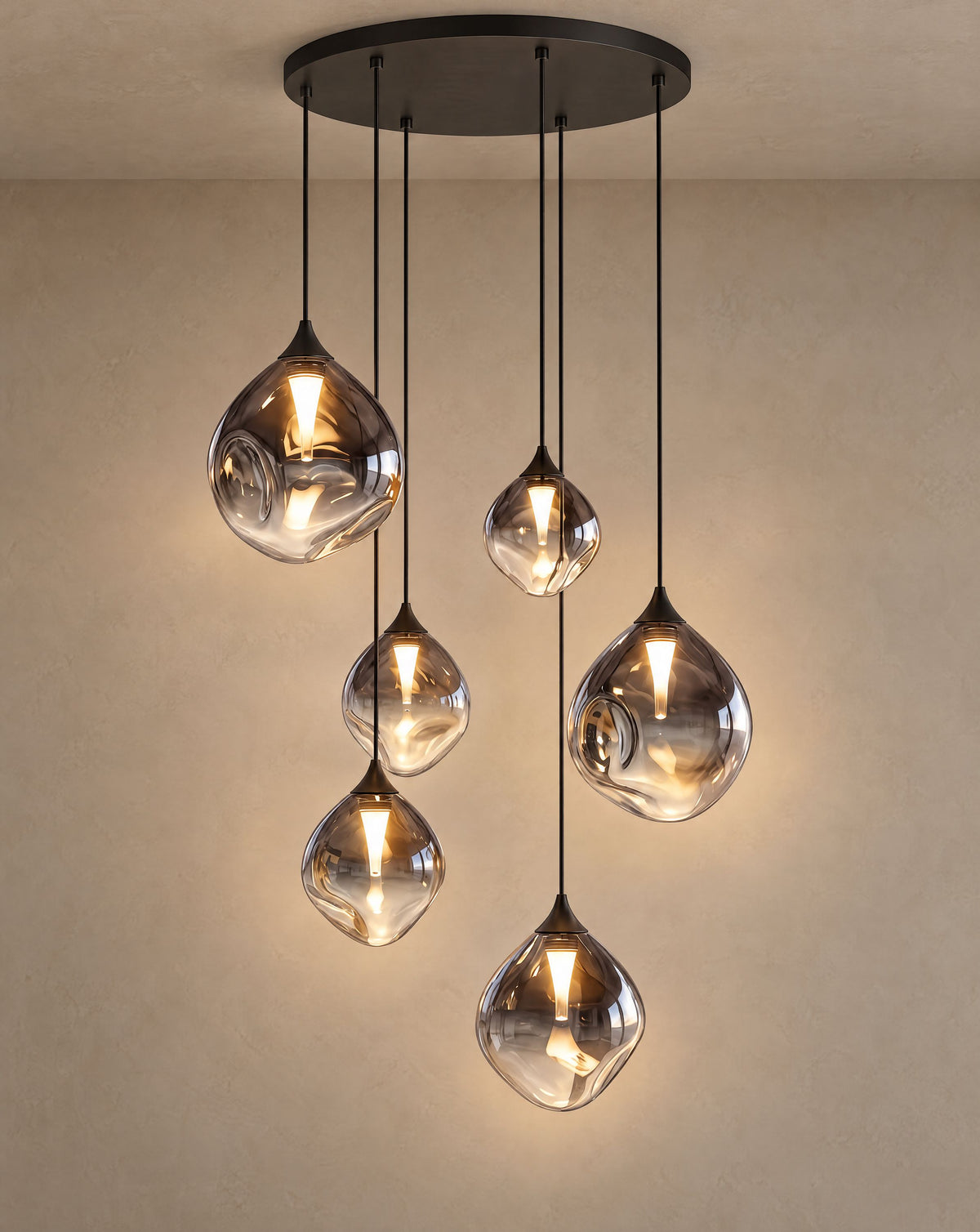 Solsence Cascade glass pendant light - Black lit with warm 3000K glow on a greige wall