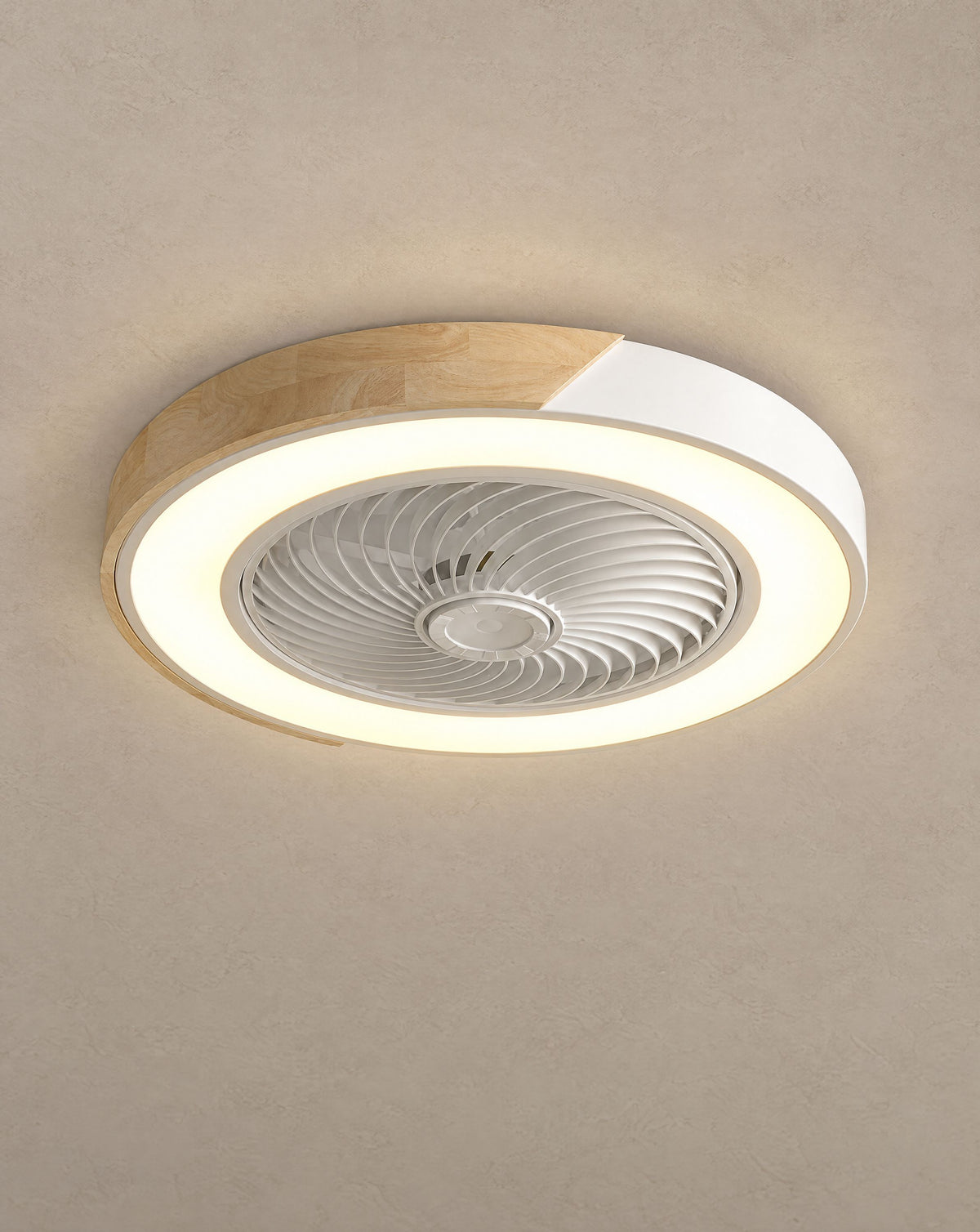 Solsence Aeris white round bladeless ceiling fan with light lit with warm 3000K glow against a greige backdrop