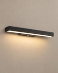 SCI Lighting Argus black LED linear outdoor wall light lit with warm 3000K glow on a greige wall