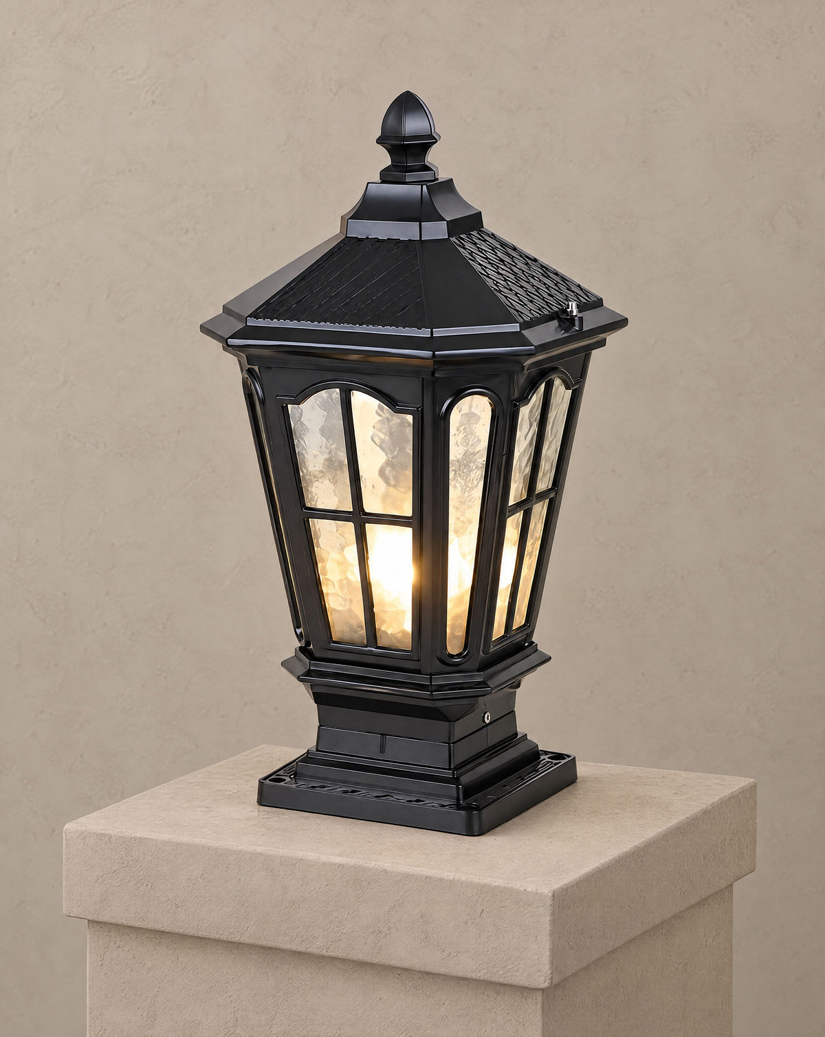 Solsence Pagoda black hardwired pillar light lit with warm 3000K glow on a greige wall