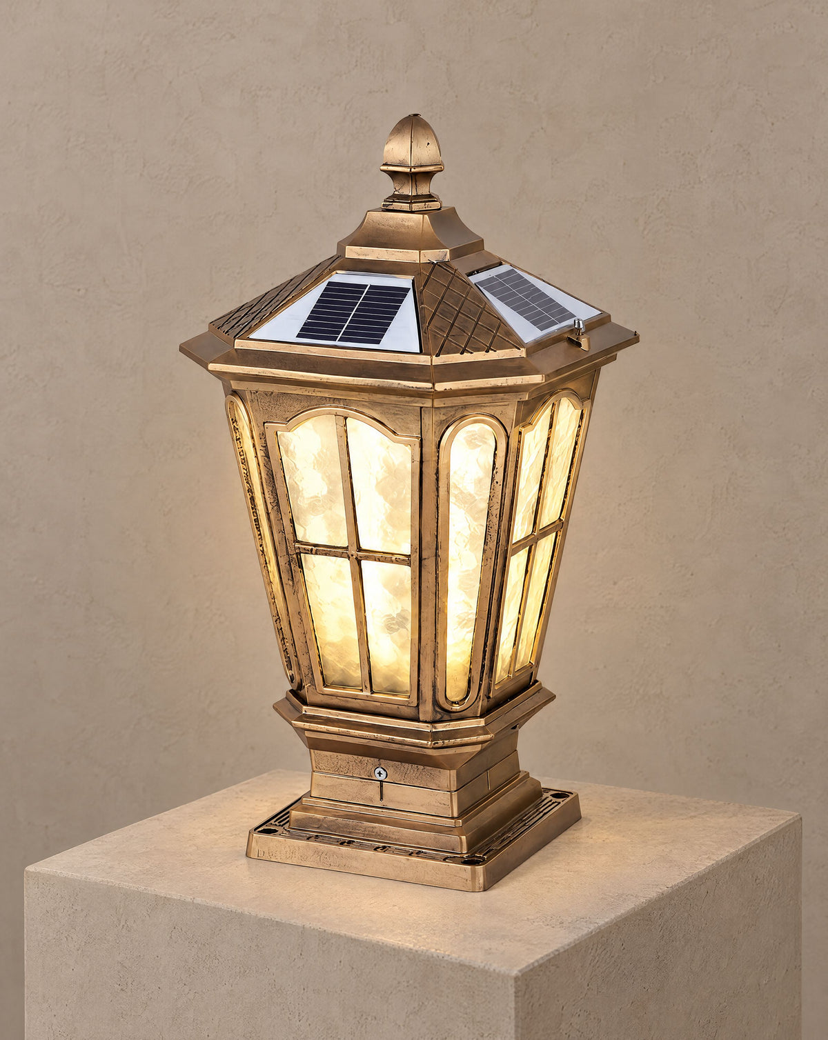Solsence Pagoda bronze solar pillar light lit with warm 3000K glow on a greige wall