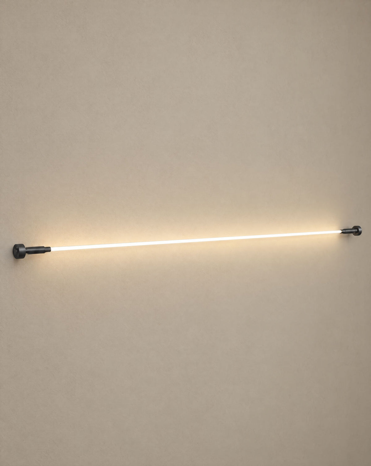 Solsence Strand white linear LED strip light lit with warm 3000K glow against a greige backdrop