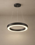 Solsence Corona black ring pendant light lit with warm 3000K glow against a greige backdrop