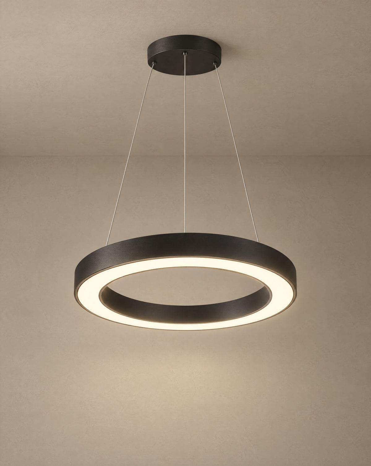 Solsence Corona black ring pendant light lit with warm 3000K glow against a greige backdrop