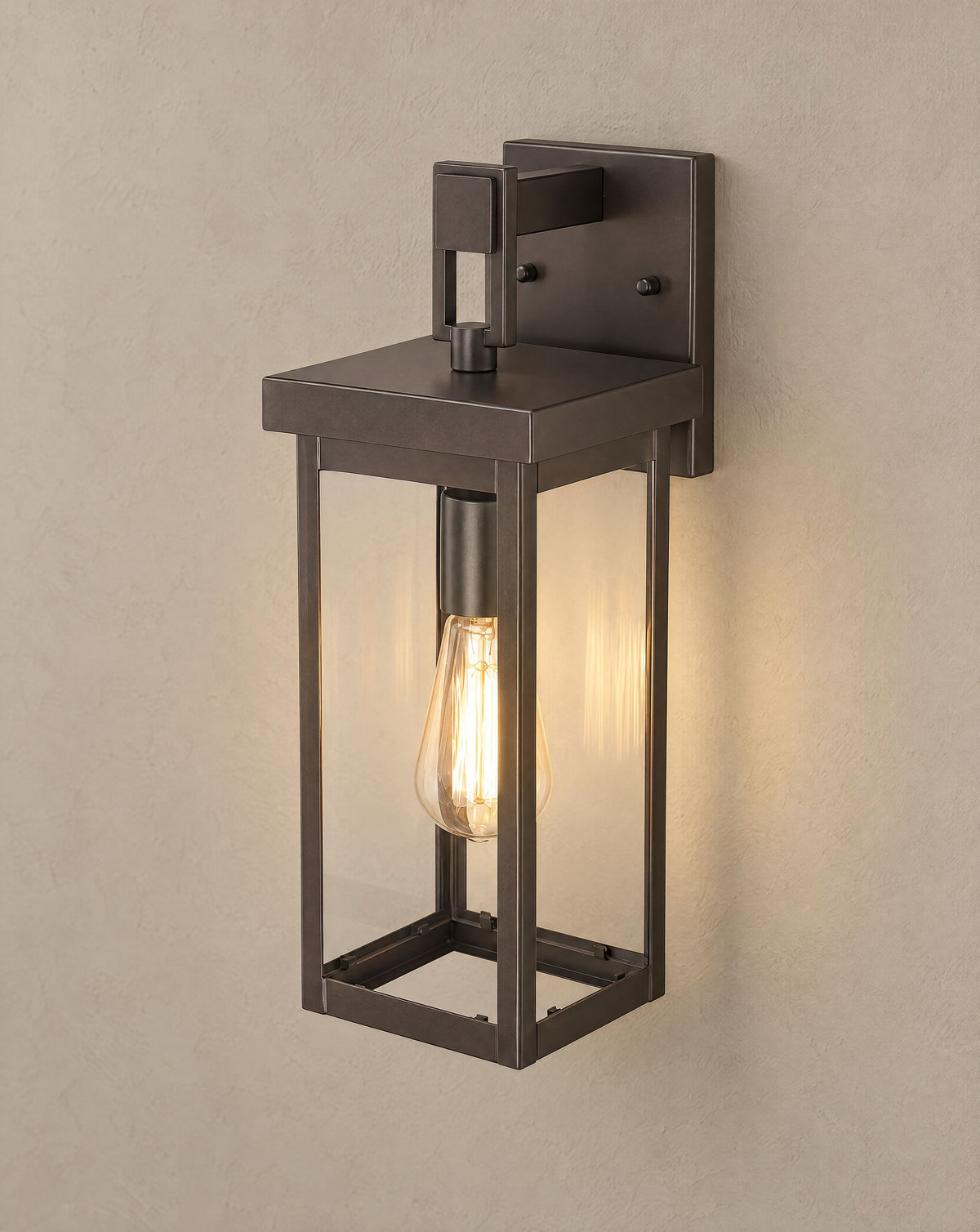 Solsence Wren outdoor wall sconce lit with warm 3000K glow on a greige wall
