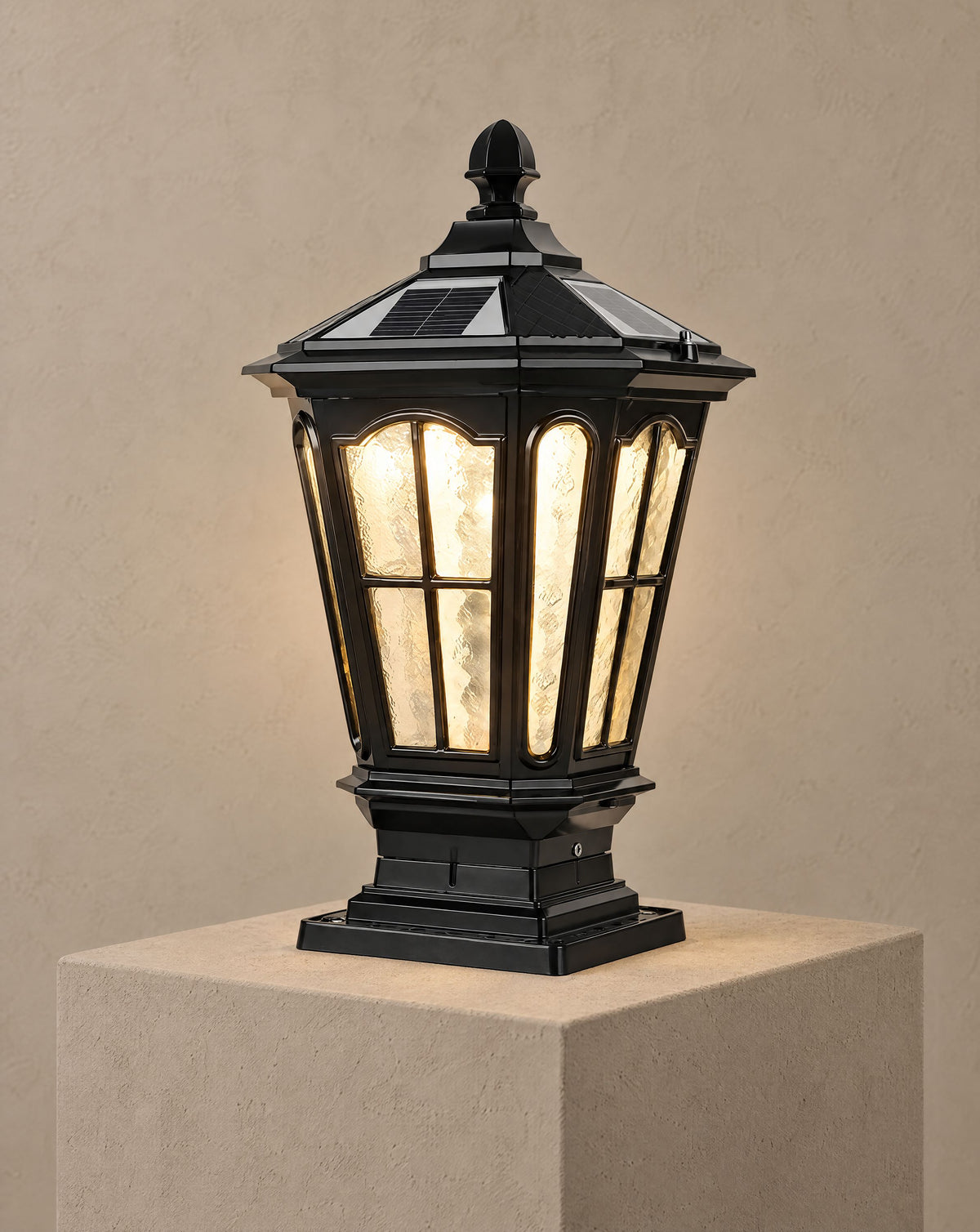 Solsence Pagoda black solar pillar light lit with warm 3000K glow on a greige wall