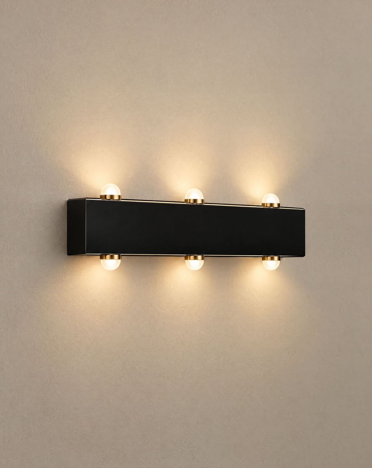 Solsence Duet up down outdoor wall light lit with warm 3000K glow on a greige wall