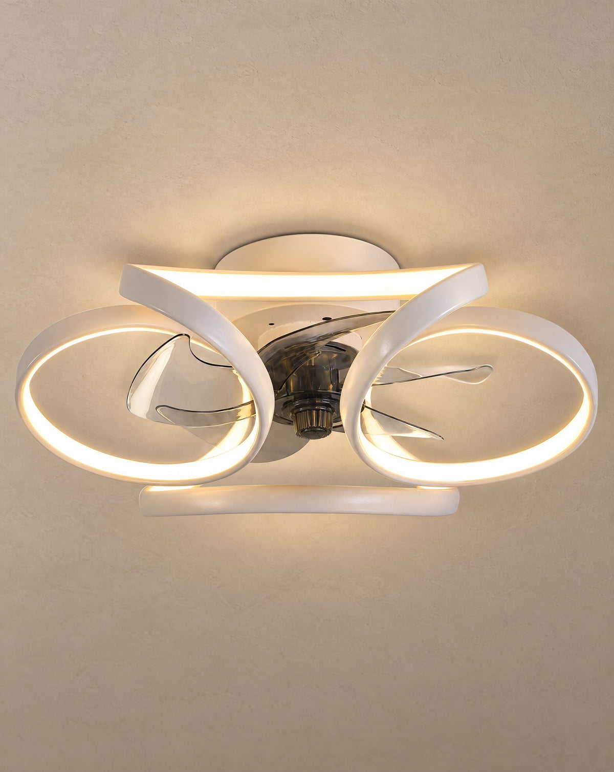 Solsence Petal white flower ceiling fan with light lit with warm 3000K glow against a greige backdrop