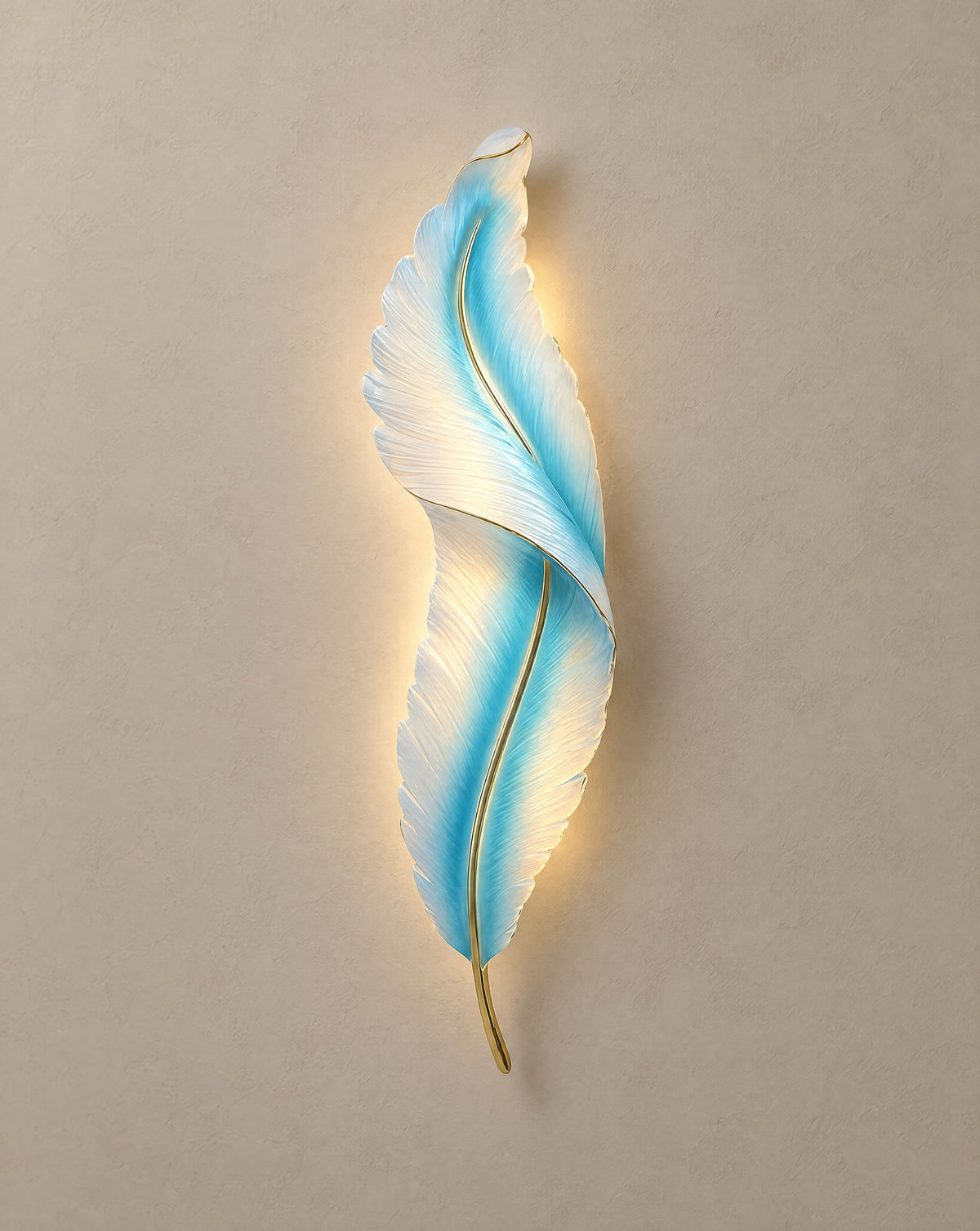 Solsence Plume blue feather wall light lit with warm 3000K glow on a greige wall