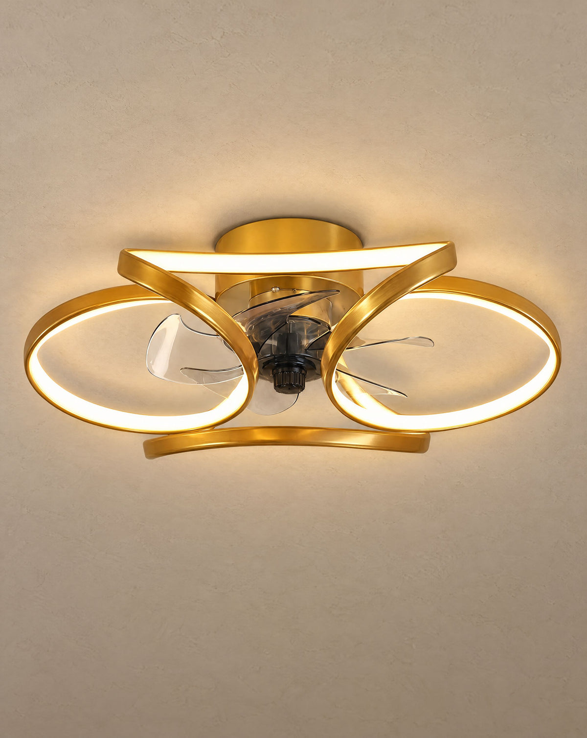 Solsence Petal gold flower ceiling fan with light lit with warm 3000K glow against a greige backdrop