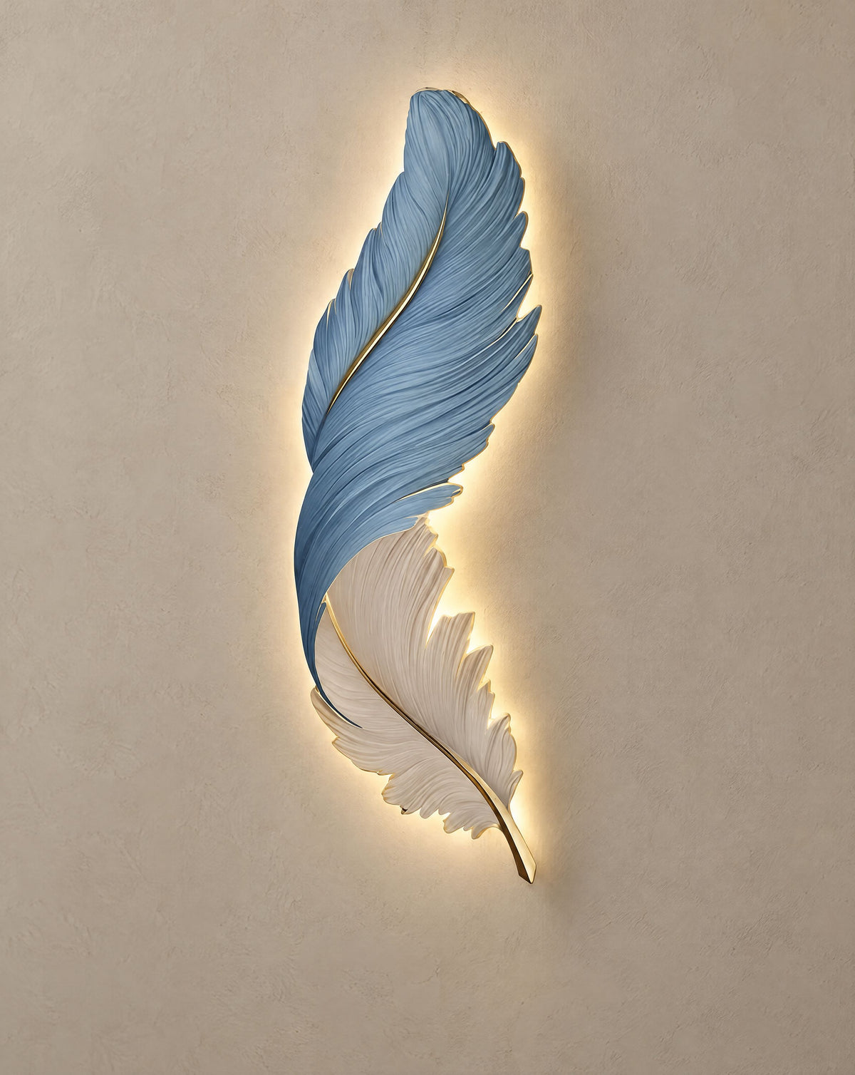 Solsence Aviary Blue feather LED wall lamp lit with warm 3000K glow on a greige wall